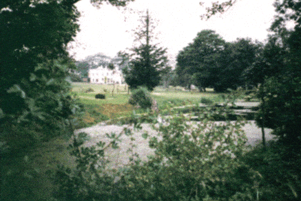 The grounds of Burnham Thorpe Parsonage as laid out by Nelson with his frigate shaped pond in the foreground